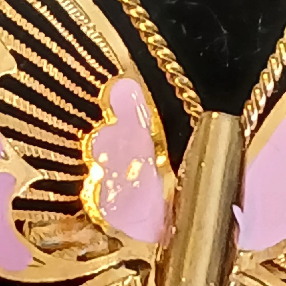 Vintage goldtone filigree butterfly brooch with pink accents